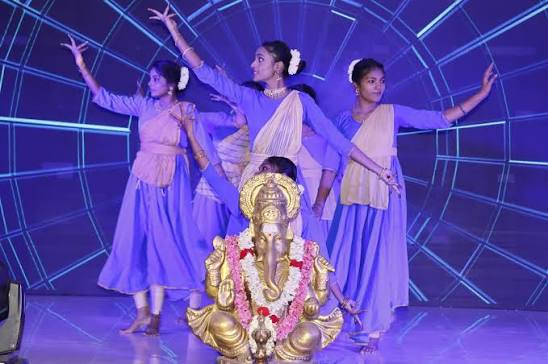 Students performing a cultural dance